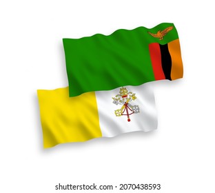 National vector fabric wave flags of Republic of Zambia and Vatican isolated on white background. 1 to 2 proportion.