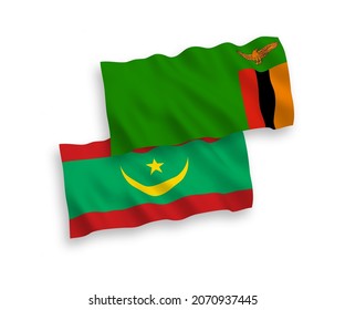 National vector fabric wave flags of Republic of Zambia and Islamic Republic of Mauritania isolated on white background. 1 to 2 proportion.