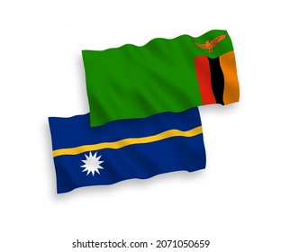 National vector fabric wave flags of Republic of Zambia and Republic of Nauru isolated on white background. 1 to 2 proportion.
