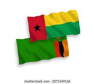 Banderas de olas de tela vectorial nacional de la República de Zambia y la República de Guinea-Bissau aisladas de fondo blanco. de 1 a 2.