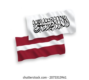 National vector fabric wave flags of Latvia and Taliban isolated on white background. 1 to 2 proportion.