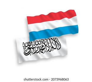 Banderas de olas de tela vectorial nacional de los talibanes y Luxemburgo aisladas en fondo blanco. de 1 a 2.
