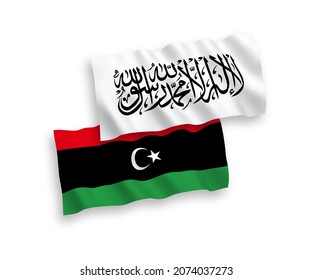 Banderas de la ola de tejido vectorial nacional de los talibanes y Libia aisladas en fondo blanco. de 1 a 2.
