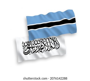 National vector fabric wave flags of Taliban and Botswana isolated on white background. 1 to 2 proportion.