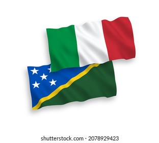 National vector fabric wave flags of Italy and Solomon Islands isolated on white background. 1 to 2 proportion.