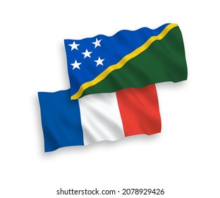 Banderas de ondulación de tela vectorial nacional de las Islas Salomón y Francia aisladas en fondo blanco. de 1 a 2.