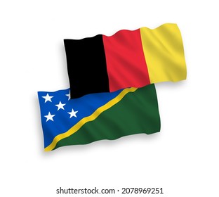 Banderas de olas de tela vectorial nacional de las Islas Salomón y Bélgica aisladas en fondo blanco. de 1 a 2.