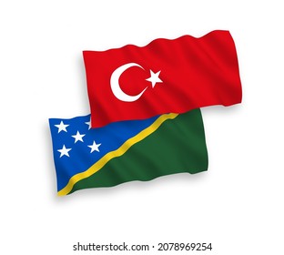 Banderas de olas de tela vectorial nacional de Turquía y las Islas Salomón aisladas en fondo blanco. de 1 a 2.