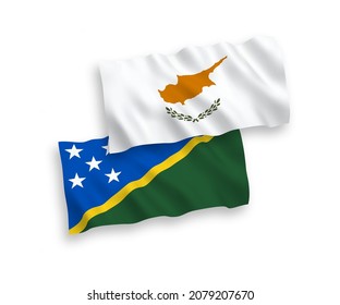 National vector fabric wave flags of Cyprus and Solomon Islands isolated on white background. 1 to 2 proportion.