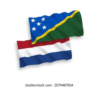 Banderas de olas de tela vectorial nacional de las Islas Salomón y los Países Bajos aisladas en fondo blanco. de 1 a 2.