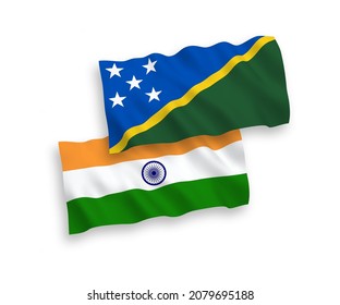 National vector fabric wave flags of India and Solomon Islands isolated on white background. 1 to 2 proportion.