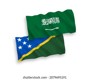 National vector fabric wave flags of Saudi Arabia and Solomon Islands isolated on white background. 1 to 2 proportion.