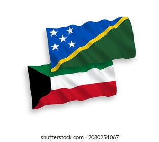 National vector fabric wave flags of Solomon Islands and Kuwait isolated on white background. 1 to 2 proportion.