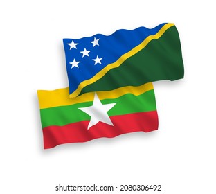 Banderas de olas de tela vectorial nacional de las Islas Salomón y Myanmar aisladas en fondo blanco. de 1 a 2.