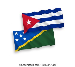 National vector fabric wave flags of Solomon Islands and Cuba isolated on white background. 1 to 2 proportion.
