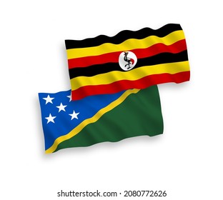 Banderas de olas de tela vectorial nacional de las Islas Salomón y Uganda aisladas sobre fondo blanco. de 1 a 2.