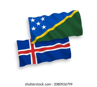 National vector fabric wave flags of Solomon Islands and Iceland isolated on white background. 1 to 2 proportion.