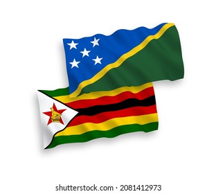 Banderas de olas de tela vectorial nacional de las Islas Salomón y Zimbabwe aisladas en fondo blanco. de 1 a 2.