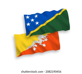 National vector fabric wave flags of Solomon Islands and Kingdom of Bhutan isolated on white background. 1 to 2 proportion.