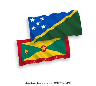 National vector fabric wave flags of Solomon Islands and Grenada isolated on white background. 1 to 2 proportion.