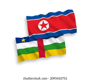 National vector fabric wave flags of North Korea and Central African Republic isolated on white background. 1 to 2 proportion.