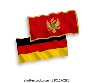 National vector fabric wave flags of Germany and Montenegro isolated on white background. 1 to 2 proportion.