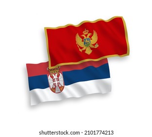 National vector fabric wave flags of Montenegro and Serbia isolated on white background. 1 to 2 proportion.