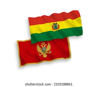 National vector fabric wave flags of Montenegro and Bolivia isolated on white background. 1 to 2 proportion.