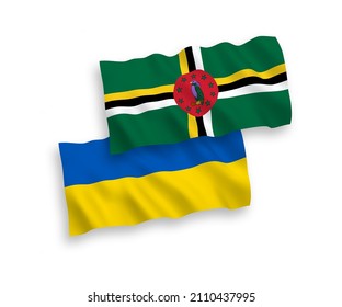 National vector fabric wave flags of Dominica and Ukraine isolated on white background. 1 to 2 proportion.