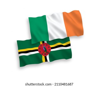 National vector fabric wave flags of Ireland and Dominica isolated on white background. 1 to 2 proportion.