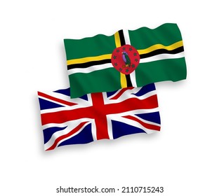 National vector fabric wave flags of Great Britain and Dominica isolated on white background. 1 to 2 proportion.