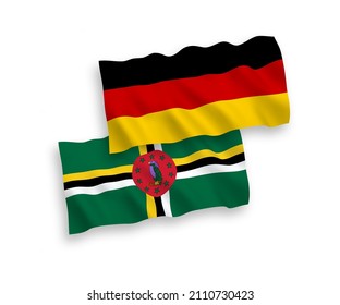National vector fabric wave flags of Germany and Dominica isolated on white background. 1 to 2 proportion.