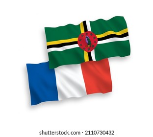 National vector fabric wave flags of France and Dominica isolated on white background. 1 to 2 proportion.