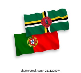 National vector fabric wave flags of Portugal and Dominica isolated on white background. 1 to 2 proportion.