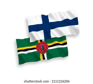 National vector fabric wave flags of Finland and Dominica isolated on white background. 1 to 2 proportion.