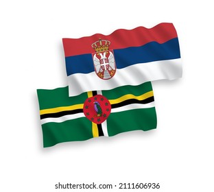 National vector fabric wave flags of Dominica and Serbia isolated on white background. 1 to 2 proportion.
