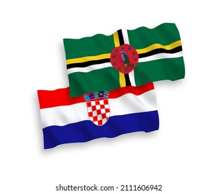 National vector fabric wave flags of Dominica and Croatia isolated on white background. 1 to 2 proportion.