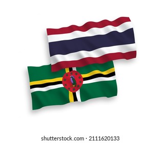 National vector fabric wave flags of Dominica and Thailand isolated on white background. 1 to 2 proportion.