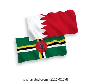 National vector fabric wave flags of Dominica and Bahrain isolated on white background. 1 to 2 proportion.
