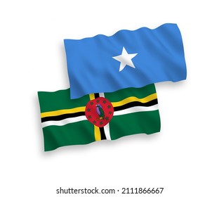 National vector fabric wave flags of Dominica and Somalia isolated on white background. 1 to 2 proportion.