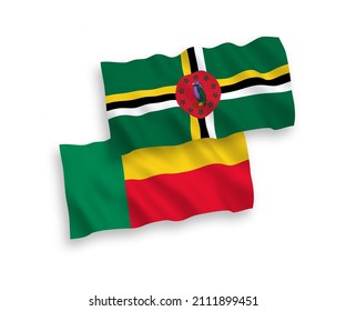 National vector fabric wave flags of Dominica and Benin isolated on white background. 1 to 2 proportion.
