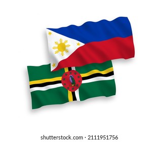 National vector fabric wave flags of Dominica and Philippines isolated on white background. 1 to 2 proportion.