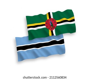 National vector fabric wave flags of Dominica and Botswana isolated on white background. 1 to 2 proportion.