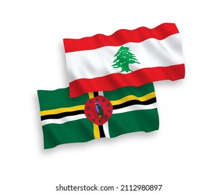 National vector fabric wave flags of Dominica and Lebanon isolated on white background. 1 to 2 proportion.