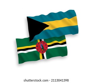 National vector fabric wave flags of Dominica and Commonwealth of The Bahamas isolated on white background. 1 to 2 proportion.
