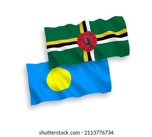National vector fabric wave flags of Dominica and Palau isolated on white background. 1 to 2 proportion.