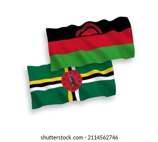 National vector fabric wave flags of Dominica and Malawi isolated on white background. 1 to 2 proportion.