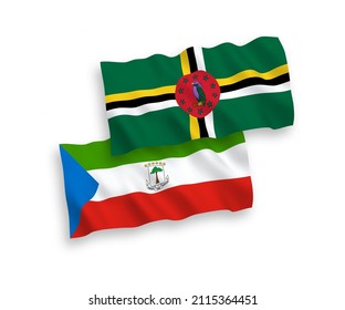 National vector fabric wave flags of Dominica and Republic of Equatorial Guinea isolated on white background. 1 to 2 proportion.