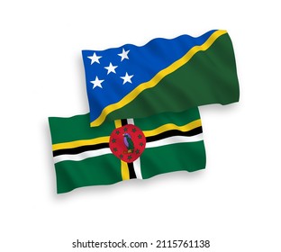 National vector fabric wave flags of Dominica and Solomon Islands isolated on white background. 1 to 2 proportion.
