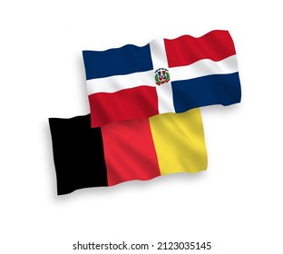 National vector fabric wave flags of Dominican Republic and Belgium isolated on white background. 1 to 2 proportion.